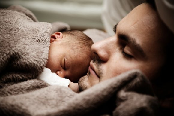 baby sleeping with dad