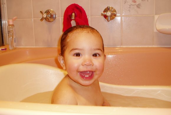 toddler having a bath