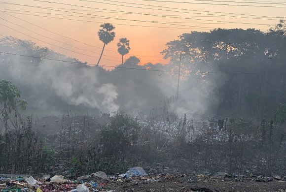 A burning roadside garbage dump near Mumbai