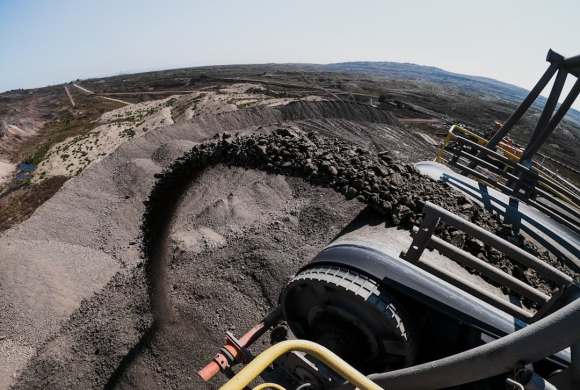 black and yellow heavy equipment on brown sand